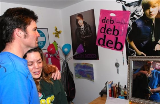 Justin Earp and Loriann Earp stand in the room of their daughter Ashley Long, on Feb. 22 in Eagle Point, Ore. Ashley died last weekend after inhaling helium from a pressurized tank during a party in Medford, Ore.